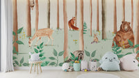 Storybook Wildlife wallpaper mural of forest animals in a kids room with plush toys and a wooden stool