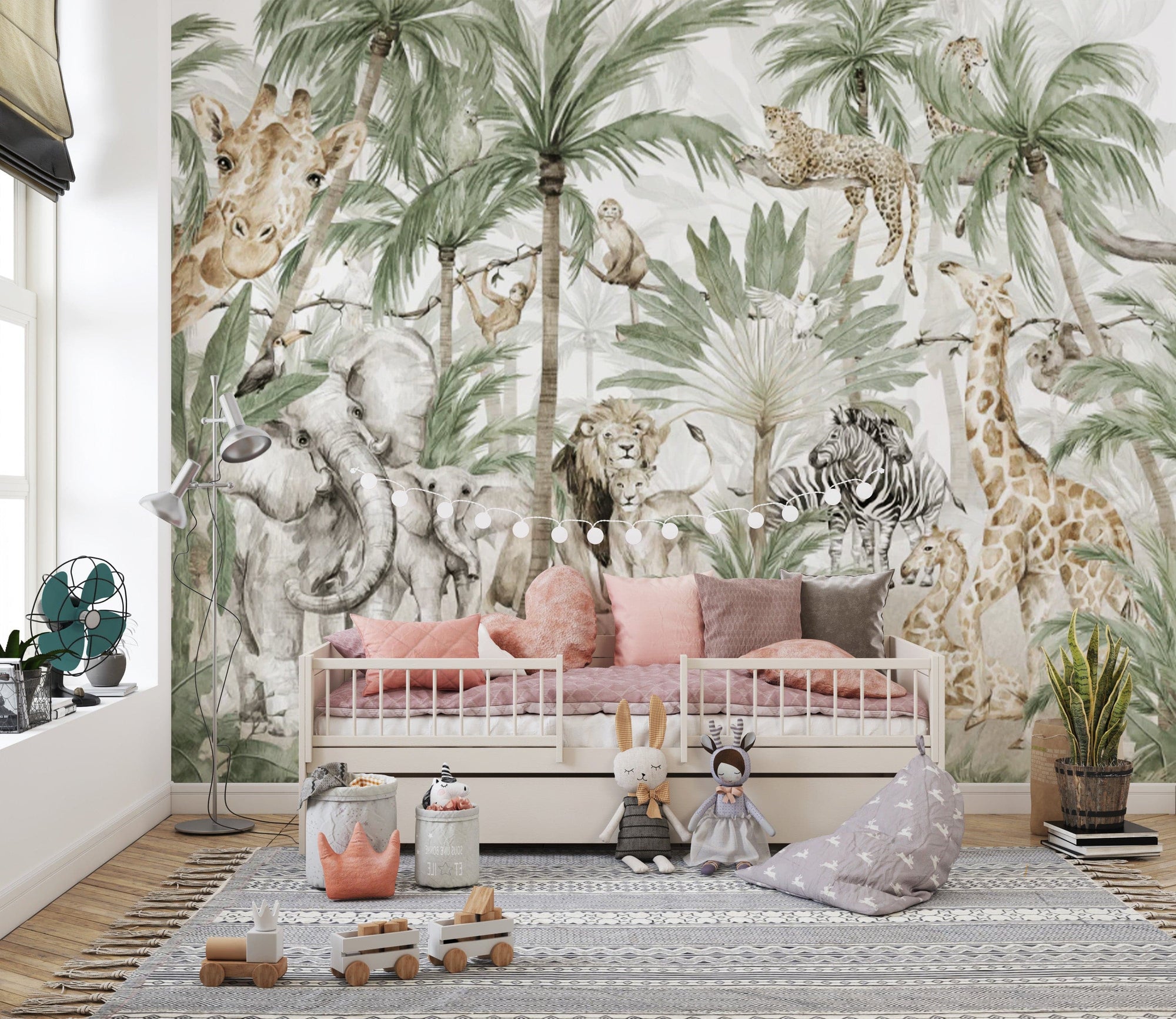 Jungle Safari Kids wallpaper mural with giraffe, elephant and lion behind a pink daybed and plush toys in a kids room