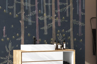 Midnight Grove Fairy Lights wallpaper mural of a dark forest behind a white vessel sink and wood vanity in a bathroom