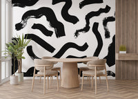 Stylish dining room with water-resistant Modern Art Black Brushstrokes Wallpaper on self adhesive vinyl for a clean look.