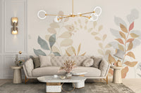 Soft Leaves wallpaper mural behind a beige tufted sofa and terrazzo table in an elegant living room