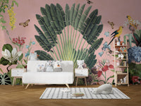 Sunbeam Canopy wallpaper mural of a tropical palm fan and parrots on pink behind a white daybed and owl plush toys in a kids room