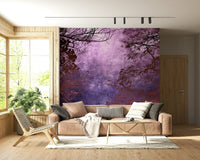 Deep purple sky wall mural framed by dark branches