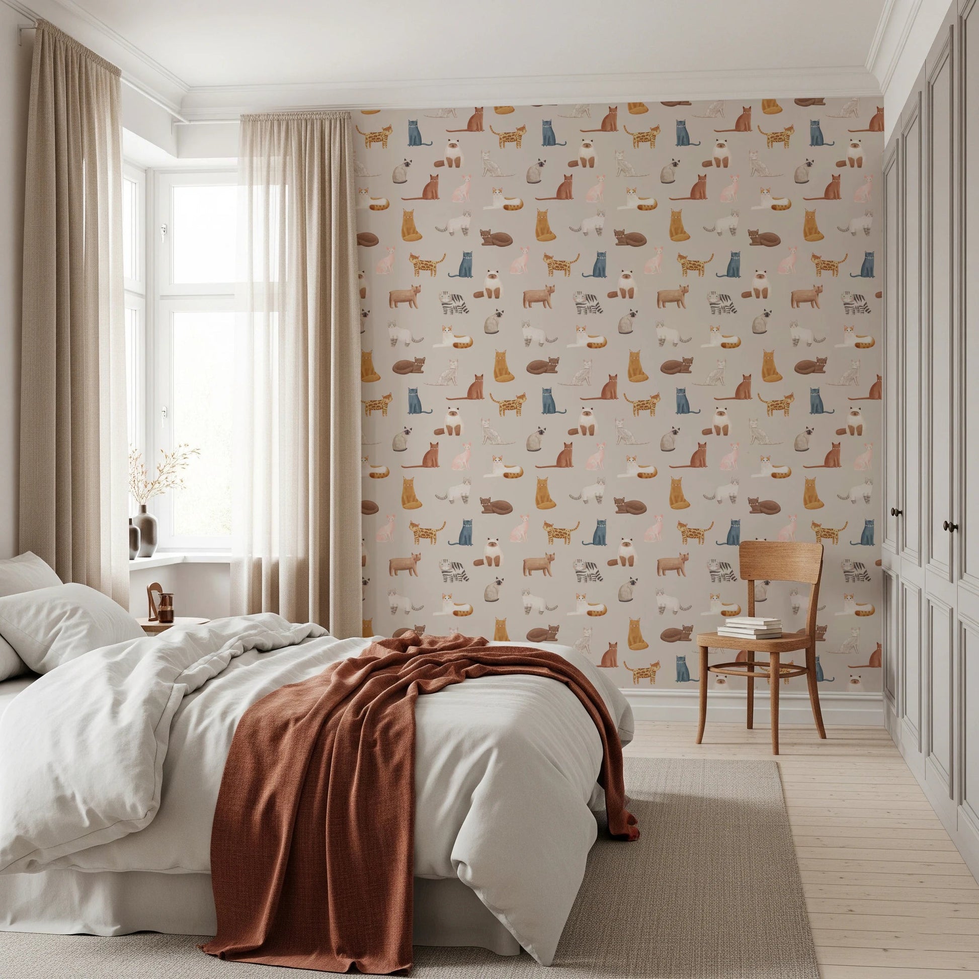Purrfectly Pawsome Cats wallpaper of cats on beige in a bedroom with white bedding and a rust throw by the window