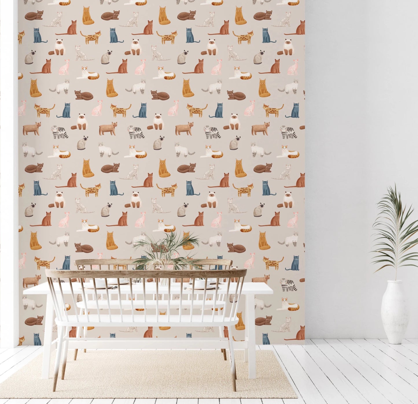 Purrfectly Pawsome Cats wallpaper of illustrated cats on beige in a dining room with a white table and spindle bench