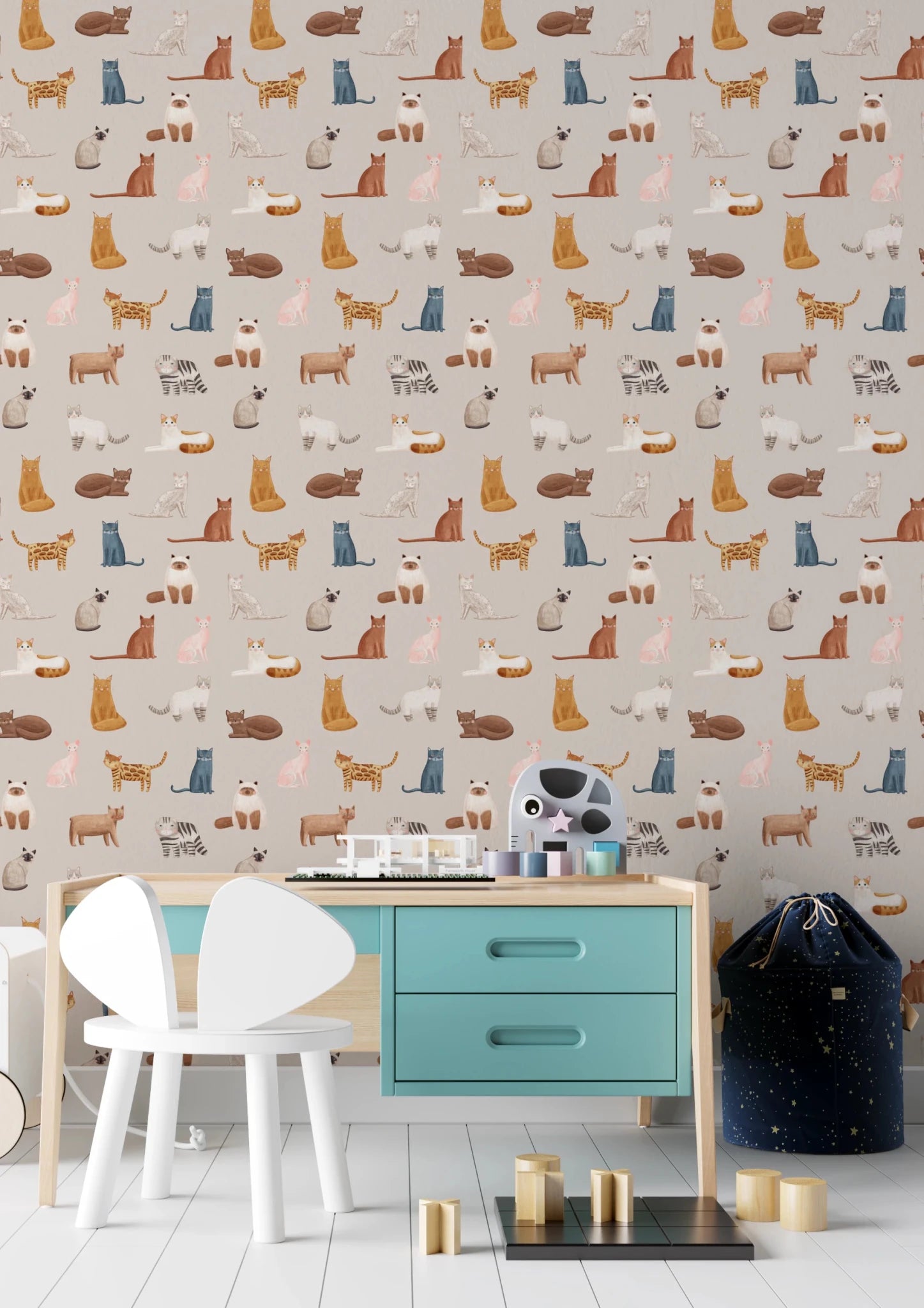 Purrfectly Pawsome Cats wallpaper on beige in a kids room with a teal-drawer desk and white mouse-ear chair