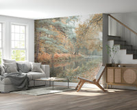 Autumn forest wallpaper with a gentle stream and leaf-covered pathway.