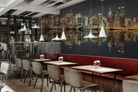 Contrast between illuminated buildings and dark water.

