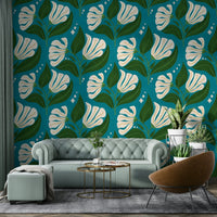 The background is a distinctive avocado teal.
