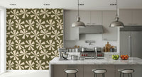 Modern vintage wallpaper with cream burst shapes scattered across an olive green design.