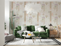 Retro Chic Art Deco wallpaper with pastel deco arches behind a green velvet sofa with tall cactus and feather pendant