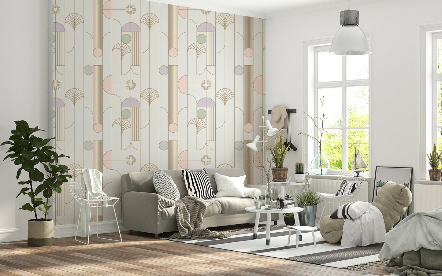 Retro Chic Art Deco wallpaper in pastel geometric pattern behind a grey sofa with wire chair and fiddle-leaf plant