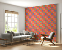 A funky wallpaper mixing pastel and neon checkerboard squares with illustrated eyes peering outward.