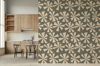 Chic vintage floral wallpaper with geometric starburst motifs across a muted green field.