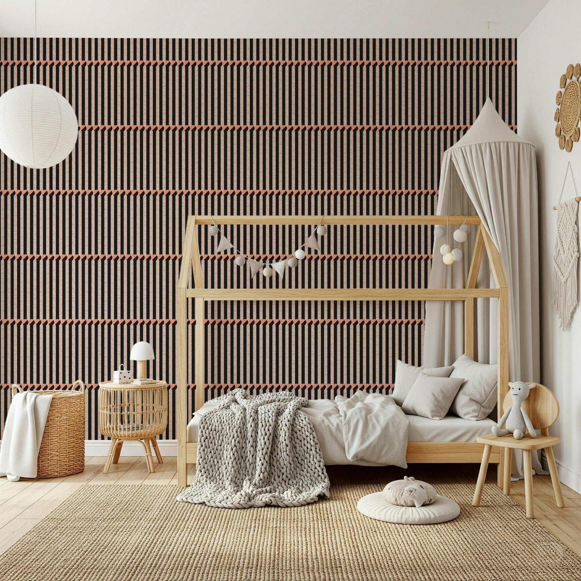 Retro Lines wallpaper in brown and black behind a wood house-frame bed in a neutral kids room