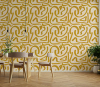 Close-up of mustard scribble strokes on retro wallpaper

