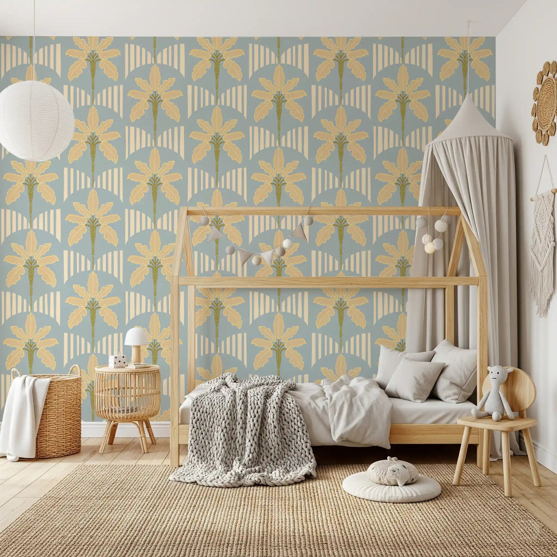 Kids bedroom with retro palm wallpaper and cream stripe arches in blue tones