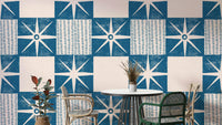 Retro starburst quilt block pattern in indigo blue

