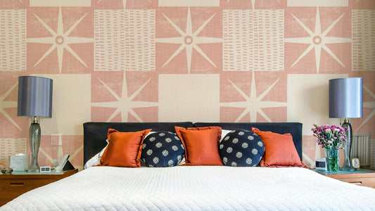 Retro starburst quilt block pattern in pink tones

