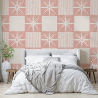Minimalist mid-century starburst wallpaper in pastel pink

