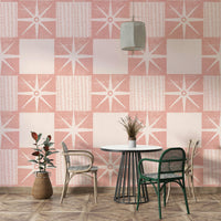 Soft pink retro starburst wallpaper with clean lines

