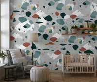 An artistic contemporary speckled mural on minimalist wallpaper.