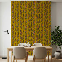 A patterned retro wallpaper with evenly spaced vine stripes and vibrant stylized leaves on a warm mustard base.