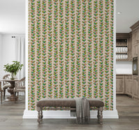 Colorful leaf designs arranged along vertical climbing vines giving the wallpaper a cheerful retro charm.