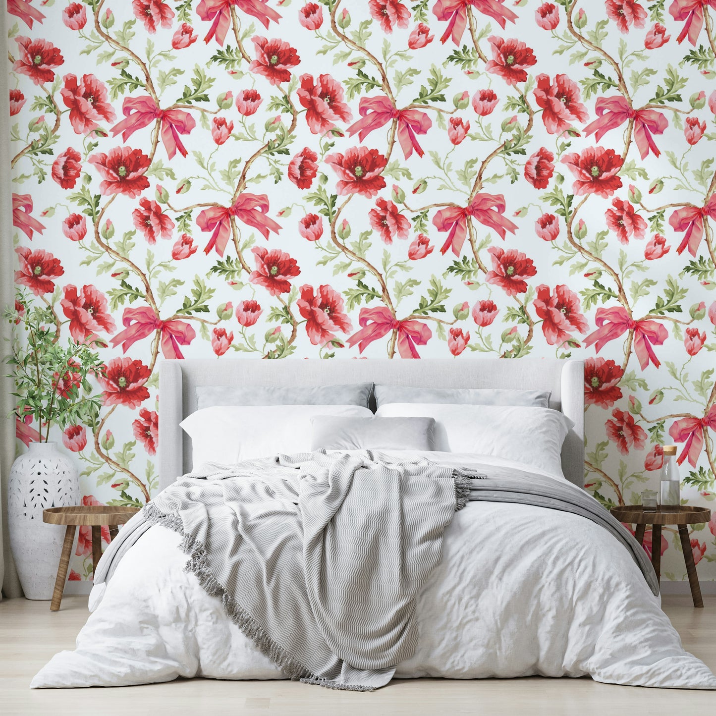Wallpaper with watercolor florals and decorative ribbon accents.

