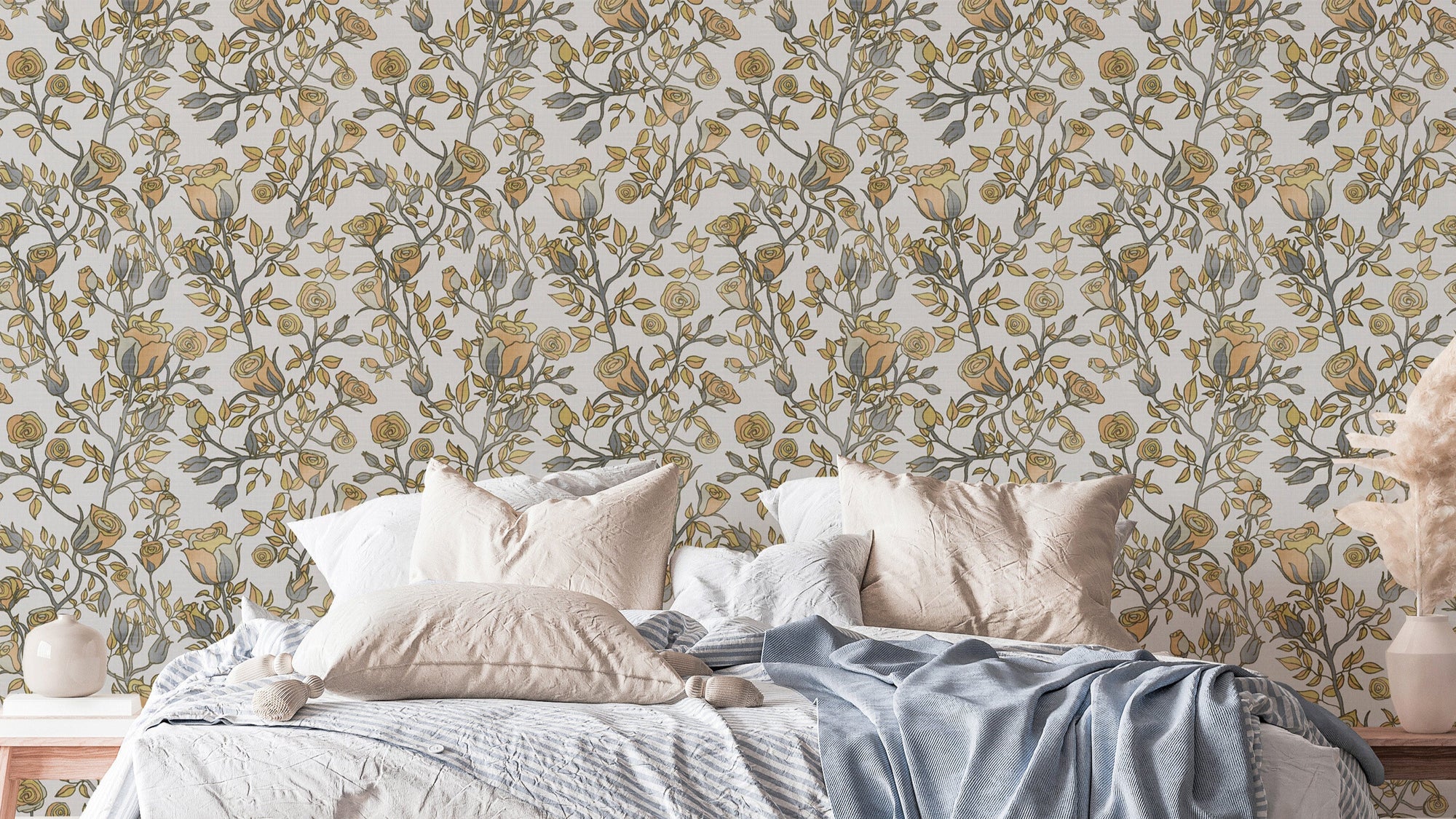 Roses Tree Golden and Gray wallpaper behind a bed with cream and blue bedding in a soft bedroom