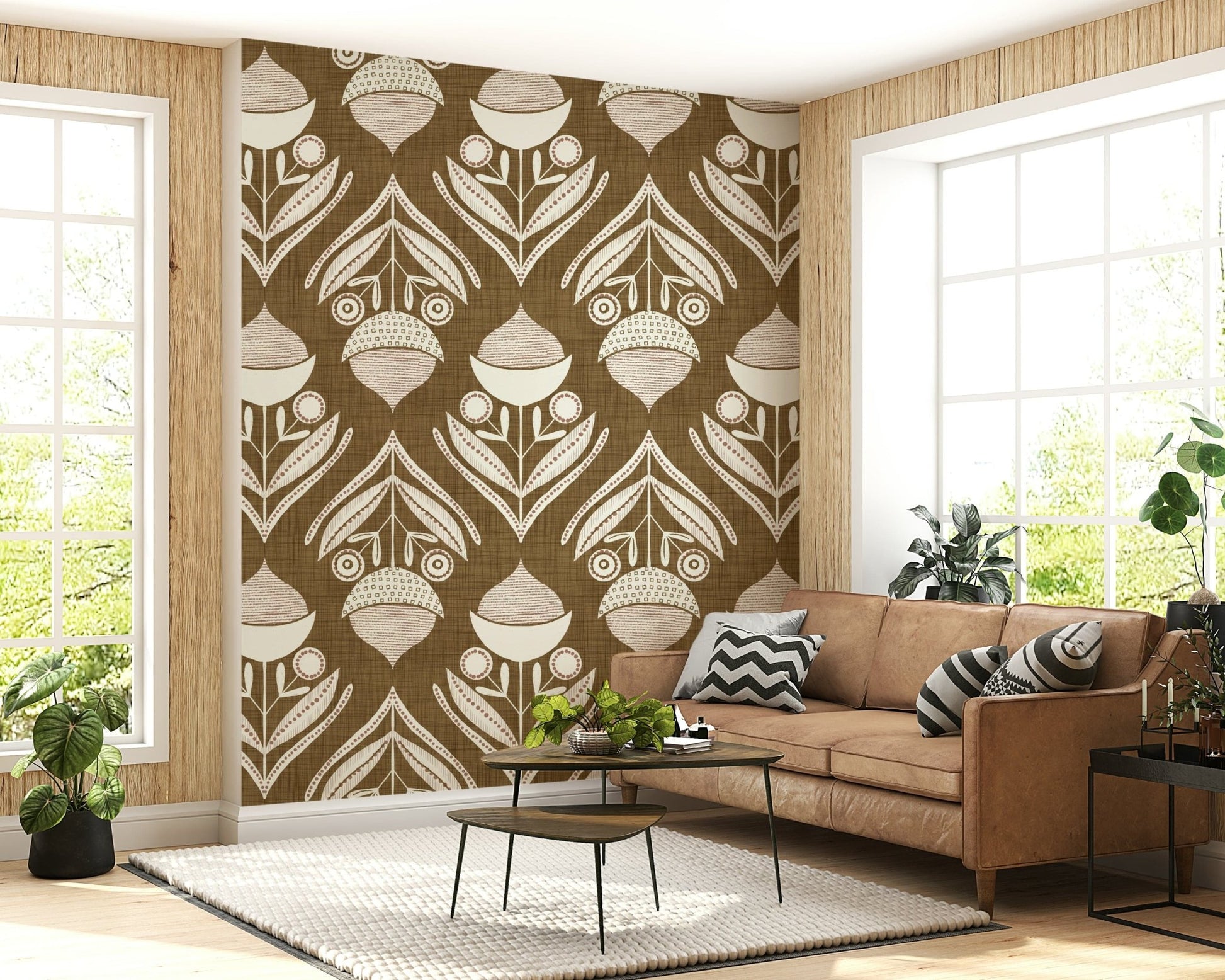 Folk-art wallpaper mural with cream and muted pink florals set against a textured brown backdrop.