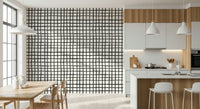 Rustic linear grid wallpaper creating a warm, natural interior style.