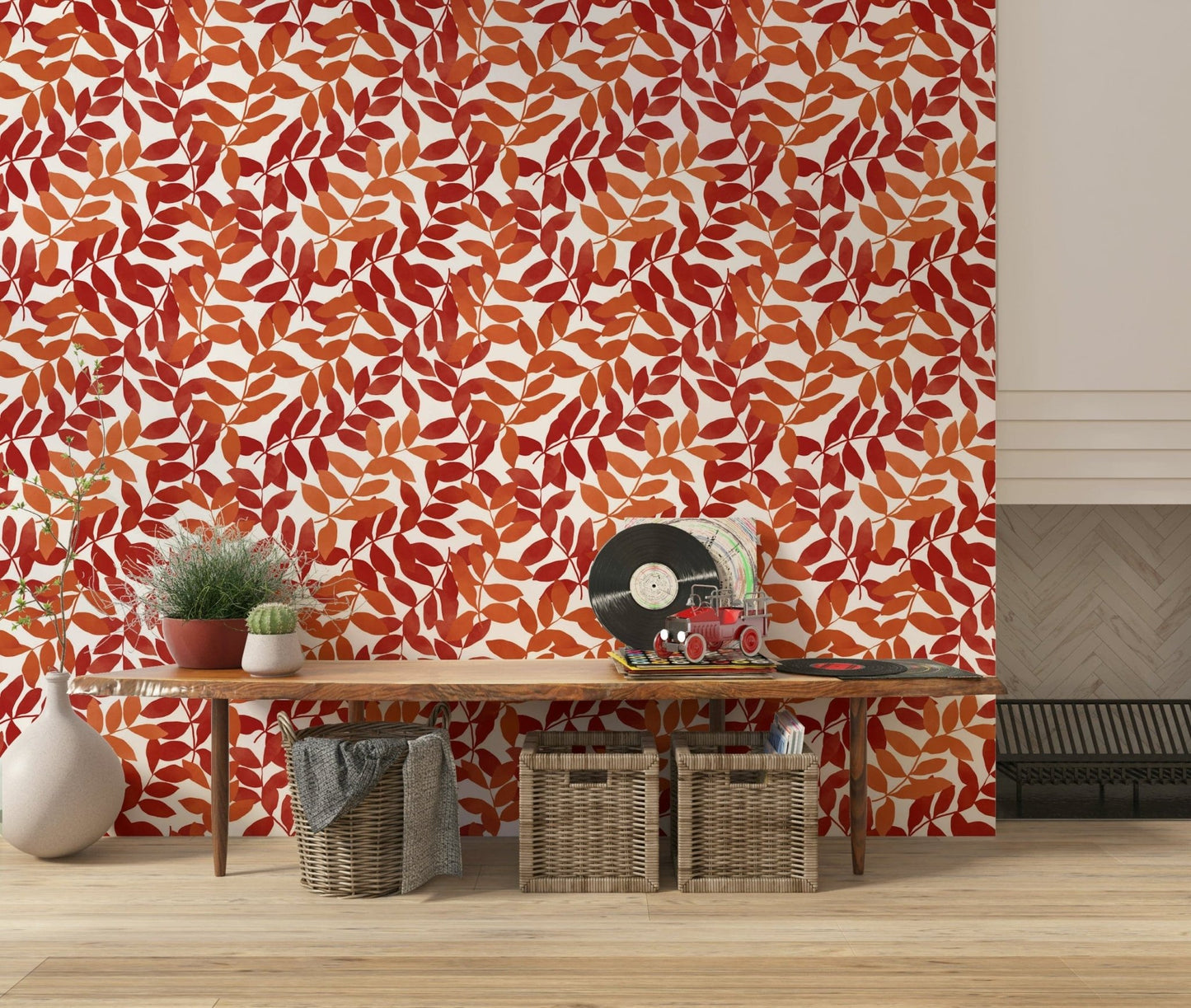 Rustic Leaves wallpaper in red and orange behind a wood console with a record player in an entryway