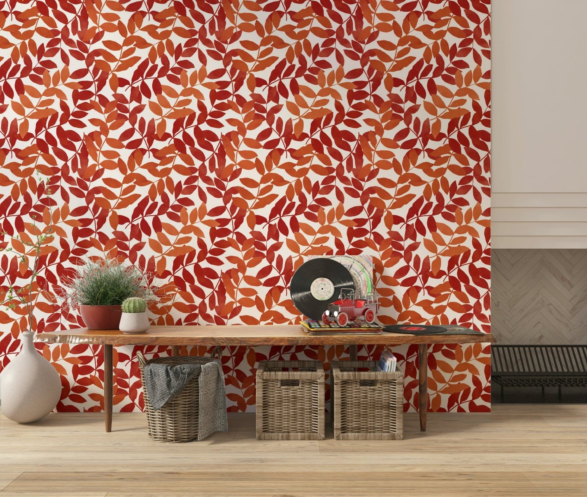 Rustic Leaves wallpaper in red and orange behind a wood console with a record player in an entryway