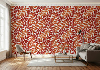 Rustic Leaves wallpaper in red and orange behind a white shell chair and grey sofa in a living room