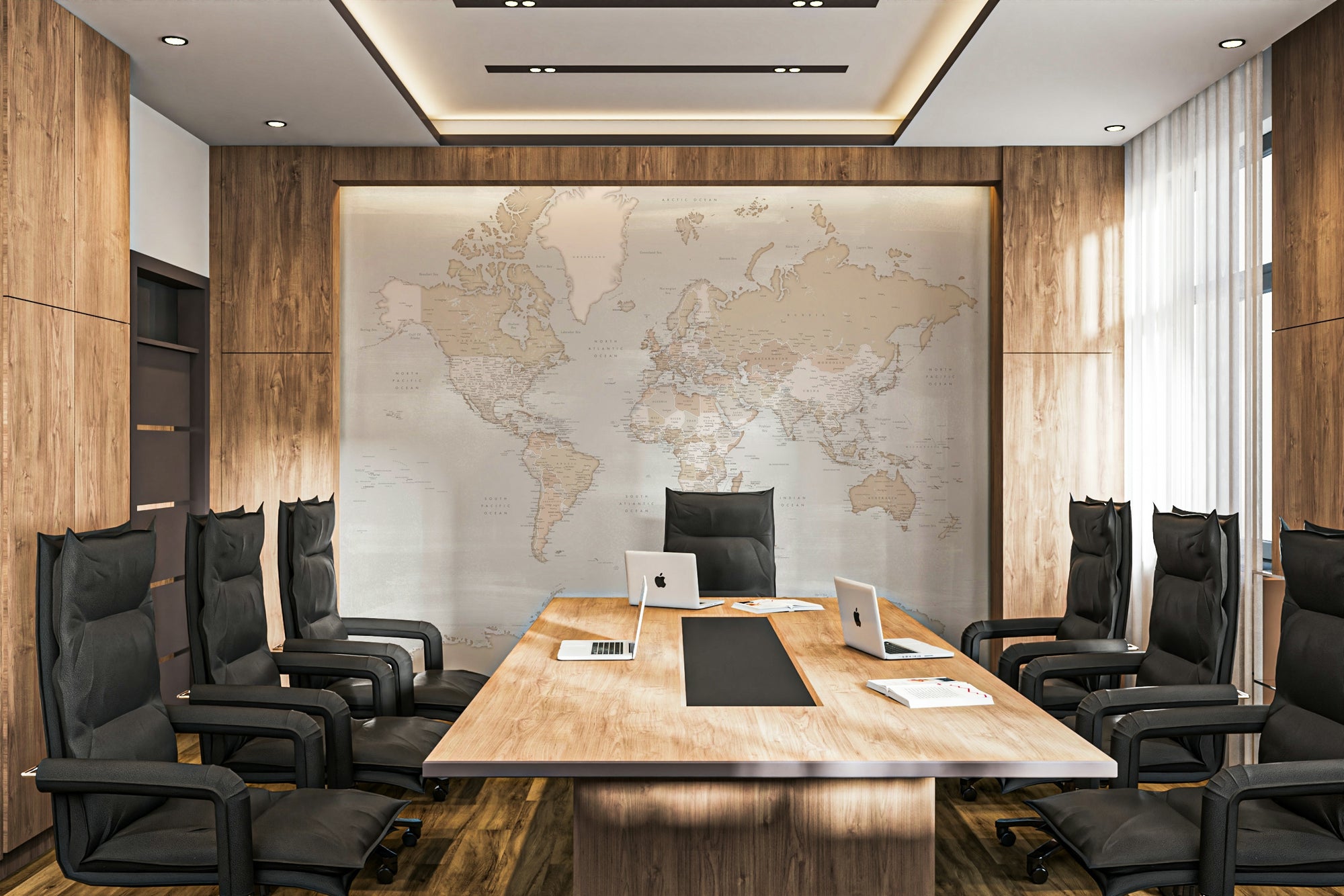 Rustic World Map wallpaper in soft beige behind a long wood conference table and black office chairs in a boardroom
