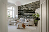 Textured wall mural with stacked stone layers creating depth and a rugged, authentic accent wall.