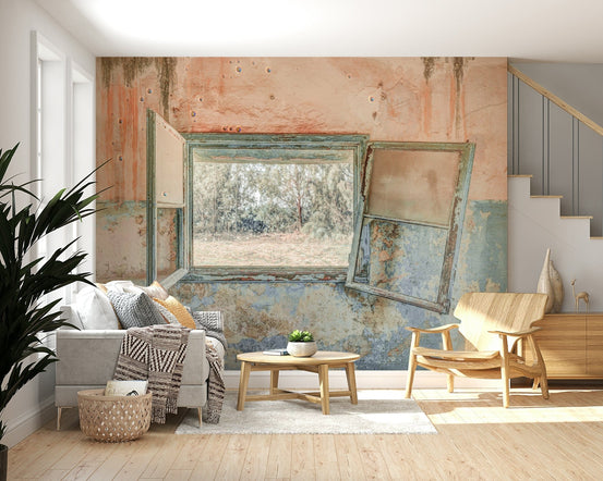 Rustic Window wallpaper mural of an open weathered window onto trees above a grey sofa and wood armchair