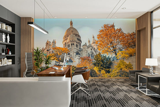 Sacre-Coeur Sunrise wallpaper mural with the white domed basilica and autumn trees behind a desk in a home office