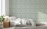 Subtle Sage Bloom Tile Wallpaper with a repetitive leaf pattern.