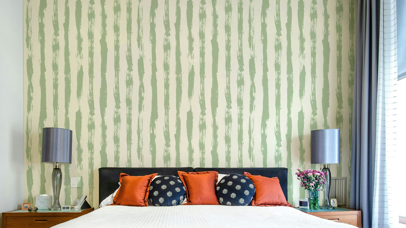 A full-wall mural showing a pattern of painted stripes.
