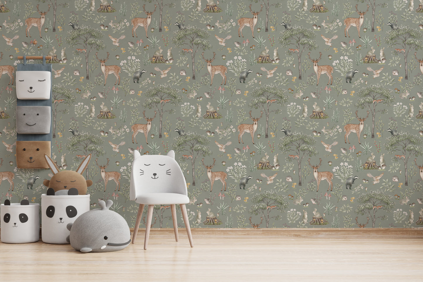 Sage Green Wildlife wallpaper as a full wall behind a white cat-shaped chair and panda storage baskets