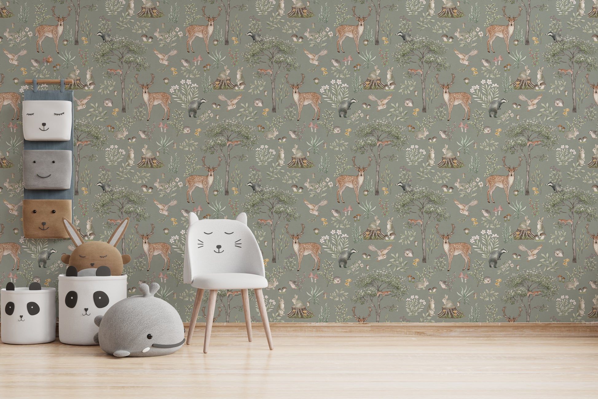 Sage Green Wildlife wallpaper as a full wall behind a white cat-shaped chair and panda storage baskets