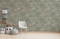 Sage Green Wildlife wallpaper as a full wall behind a white cat-shaped chair and panda storage baskets