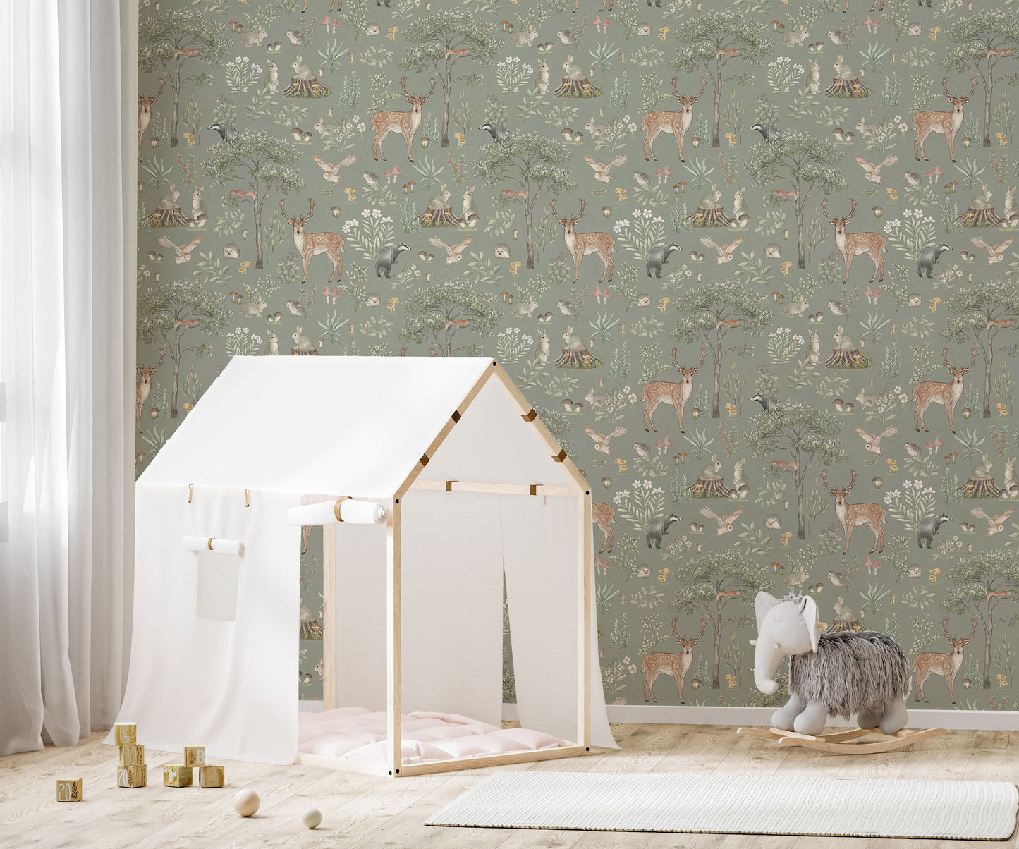 Sage Green Wildlife wallpaper behind a white play tent house and grey elephant rocker in a kids room