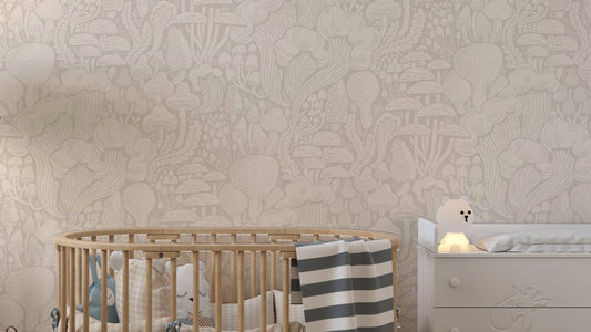 Sand Fungi Forest Silhouettes wallpaper in a soft nursery with oval wooden crib and white dresser