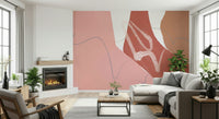 A soft blush-toned abstract wallpaper featuring flowing sandy shapes and gentle wave-like lines.