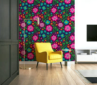 Vibrant rainbow-colored tropical flowers on a deep purple background.

