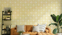 The colors are soft, muted tones of white, yellow, and gold.

