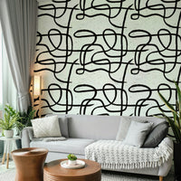 Neutral-toned wallpaper with abstract marker lines.

